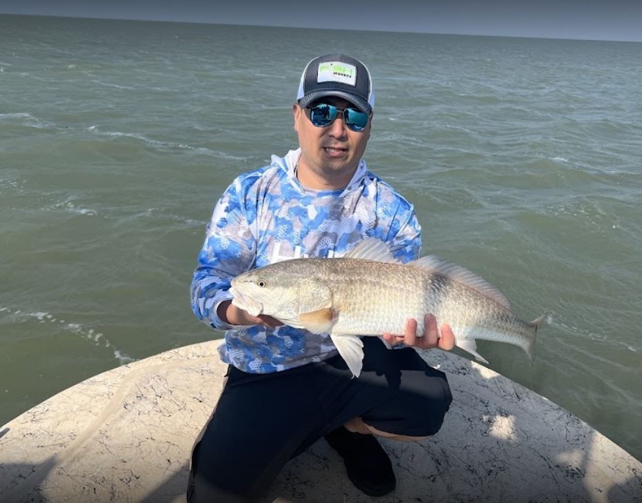 Redfish caught by fisherman during fishing trip