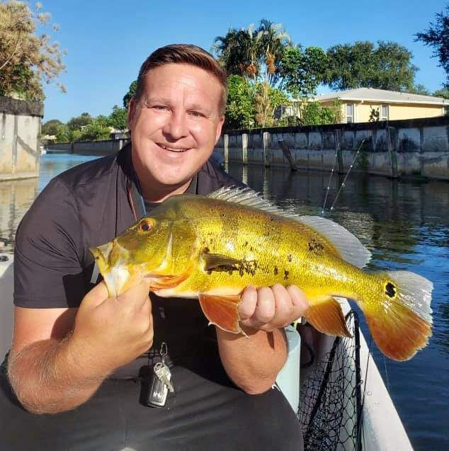 A person fishing in an unknown location