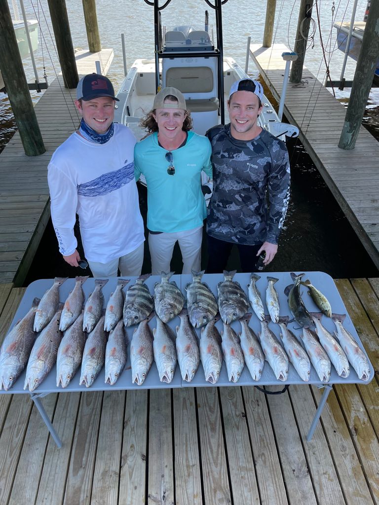 2 fishing enthusiasts with their catch
