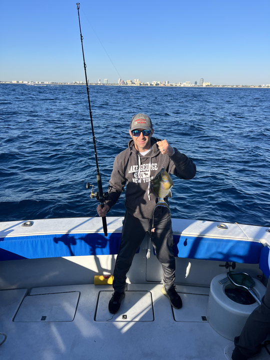 Reeling in the city views while angling offshore.