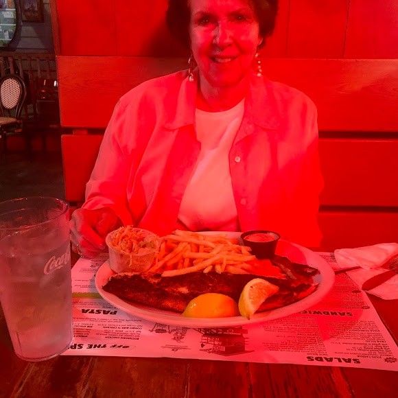 A lone person fishing at an unknown location.