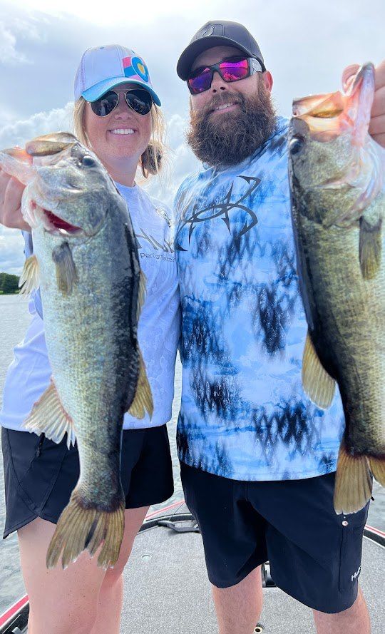 Two anglers with a large catch of fish