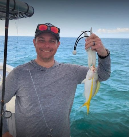 A person fishing in an unknown location