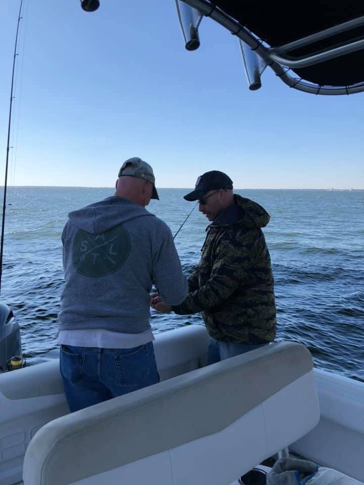 Fisherman enjoying a day of fishing at an unknown location