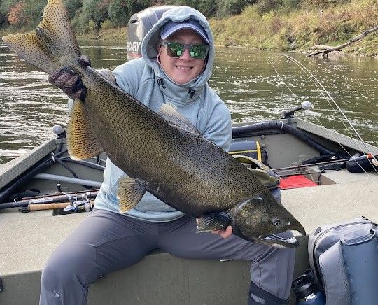 Fisherman reeling in large catch