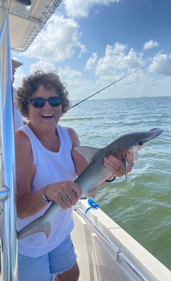 Angler holding a 23-inch fishing catch