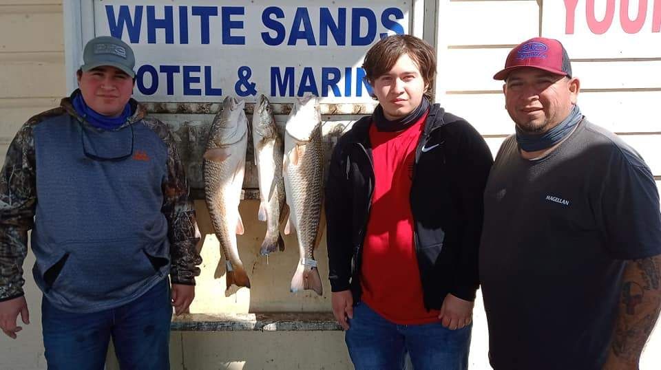 Three fishermen caught three unidentified fish using fishing technique