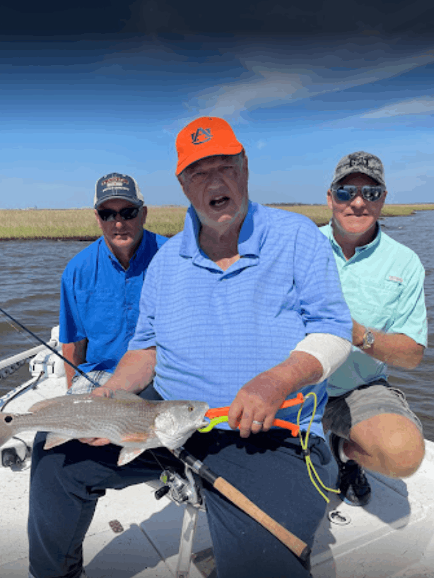 A group of 3 people fishing in an unspecified location