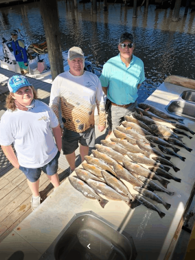 Four people fishing in unknown location
