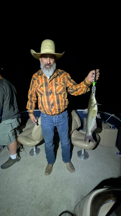 Reeling in a Channel Catfish on a clear day at Scorpion Bay!