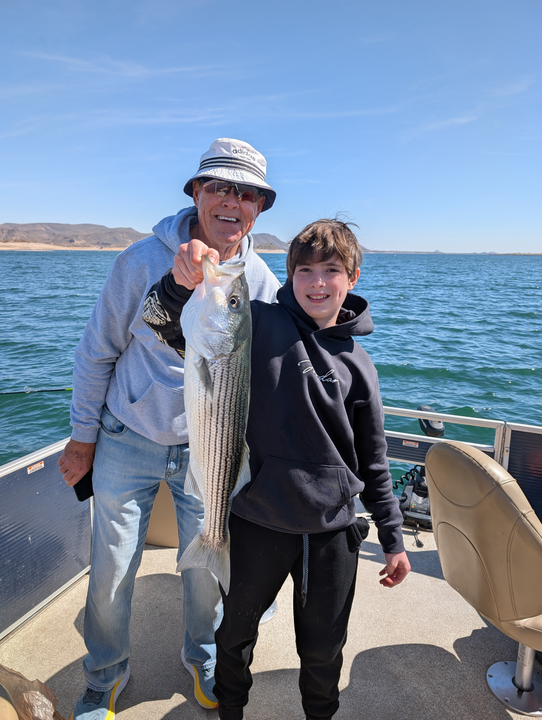 Reeling in a great catch on this picturesque lake.