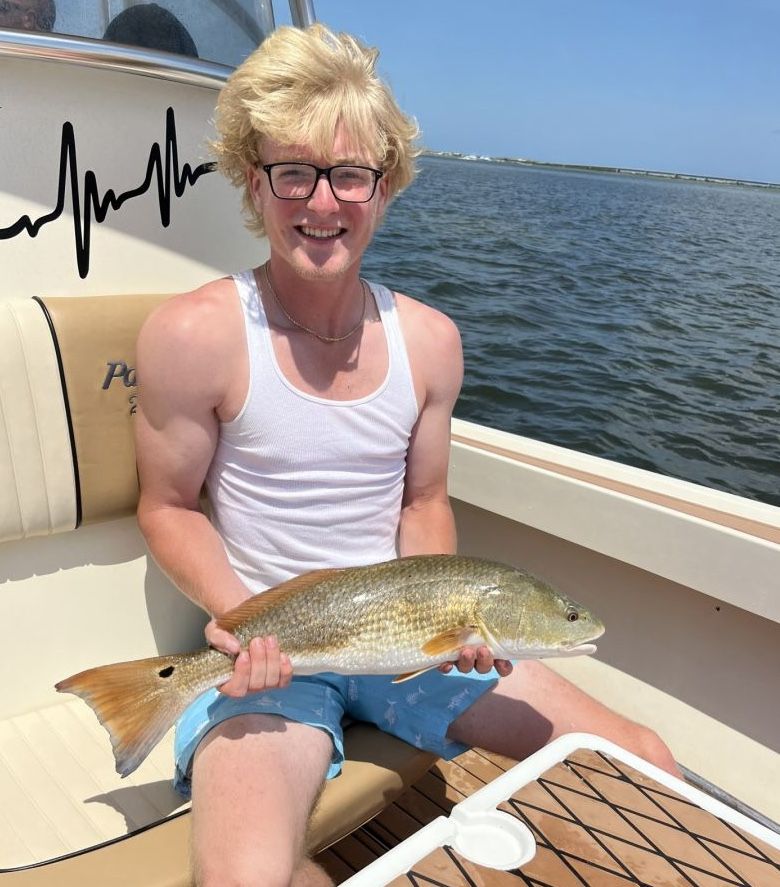 A single fisherman with a great catch