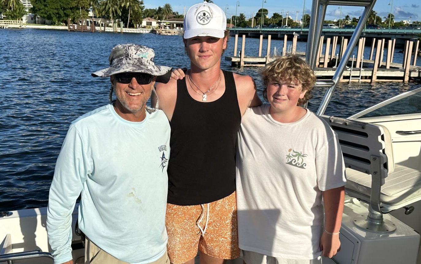 Three people fishing in a scenic location