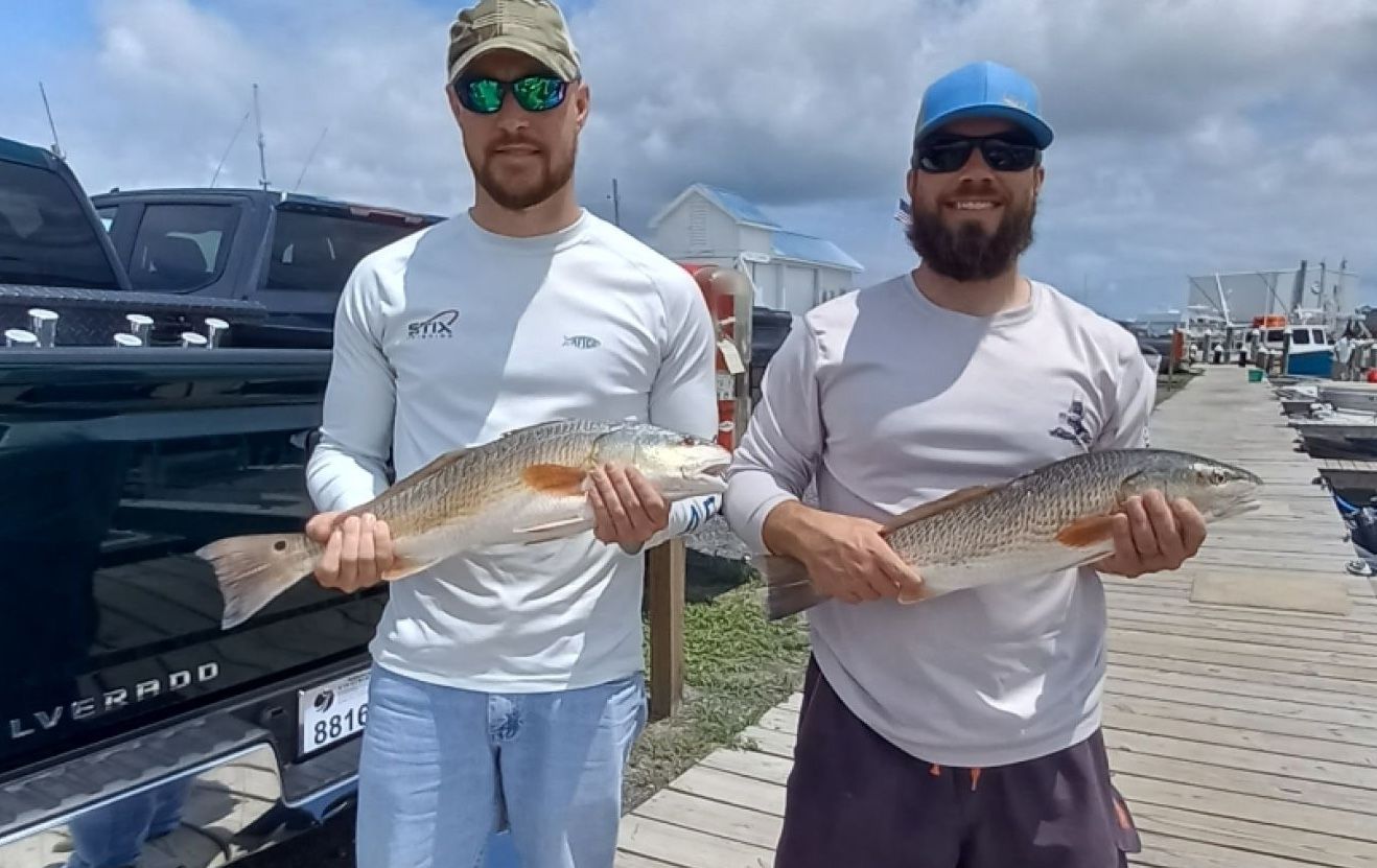 Two anglers enjoy a day of fishing