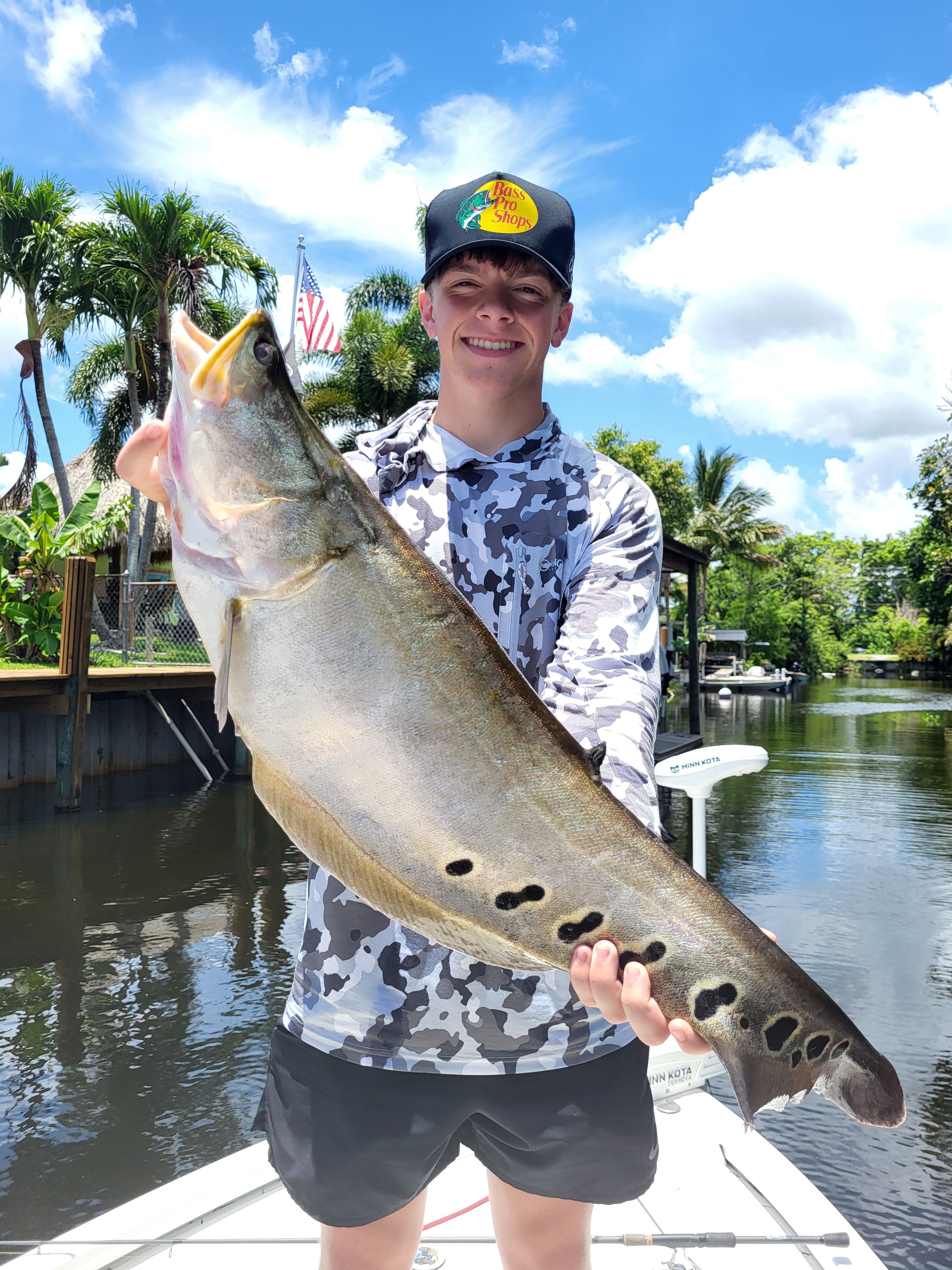 Large fish caught and displayed on fishing boat dock