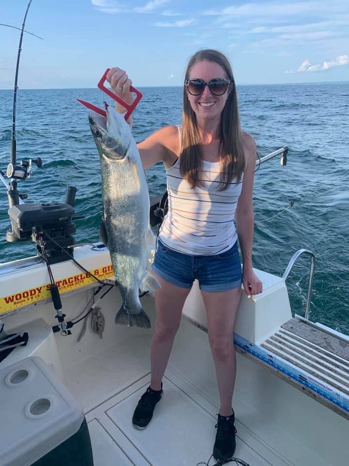 Fisherman with unknown species of 22-inch fish
