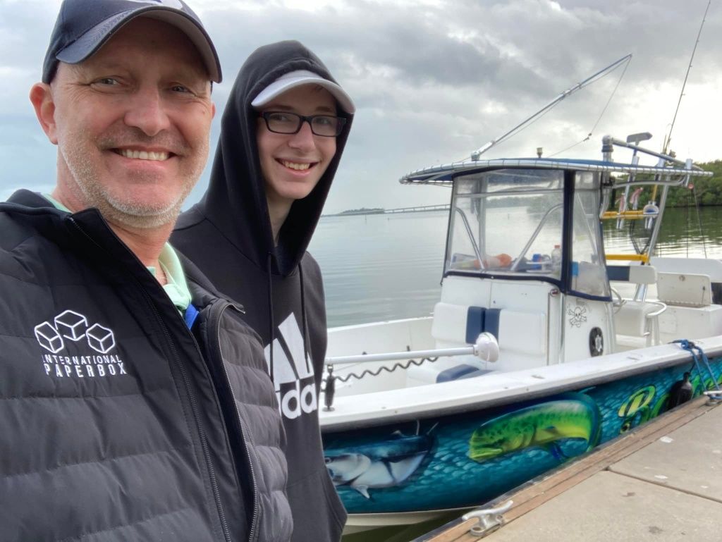 Two people fishing in unknown location