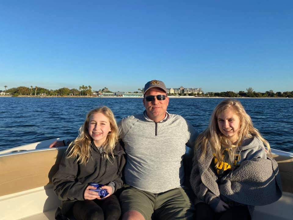 Three people fishing in a scenic location