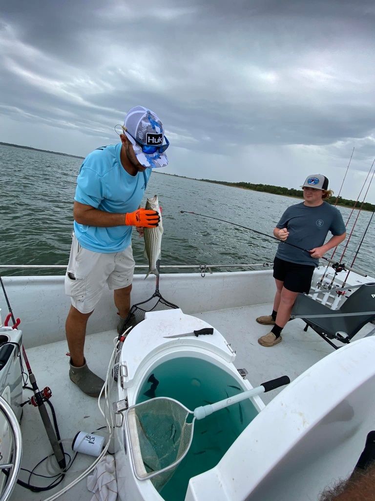 Man fishing with rod on unknown location