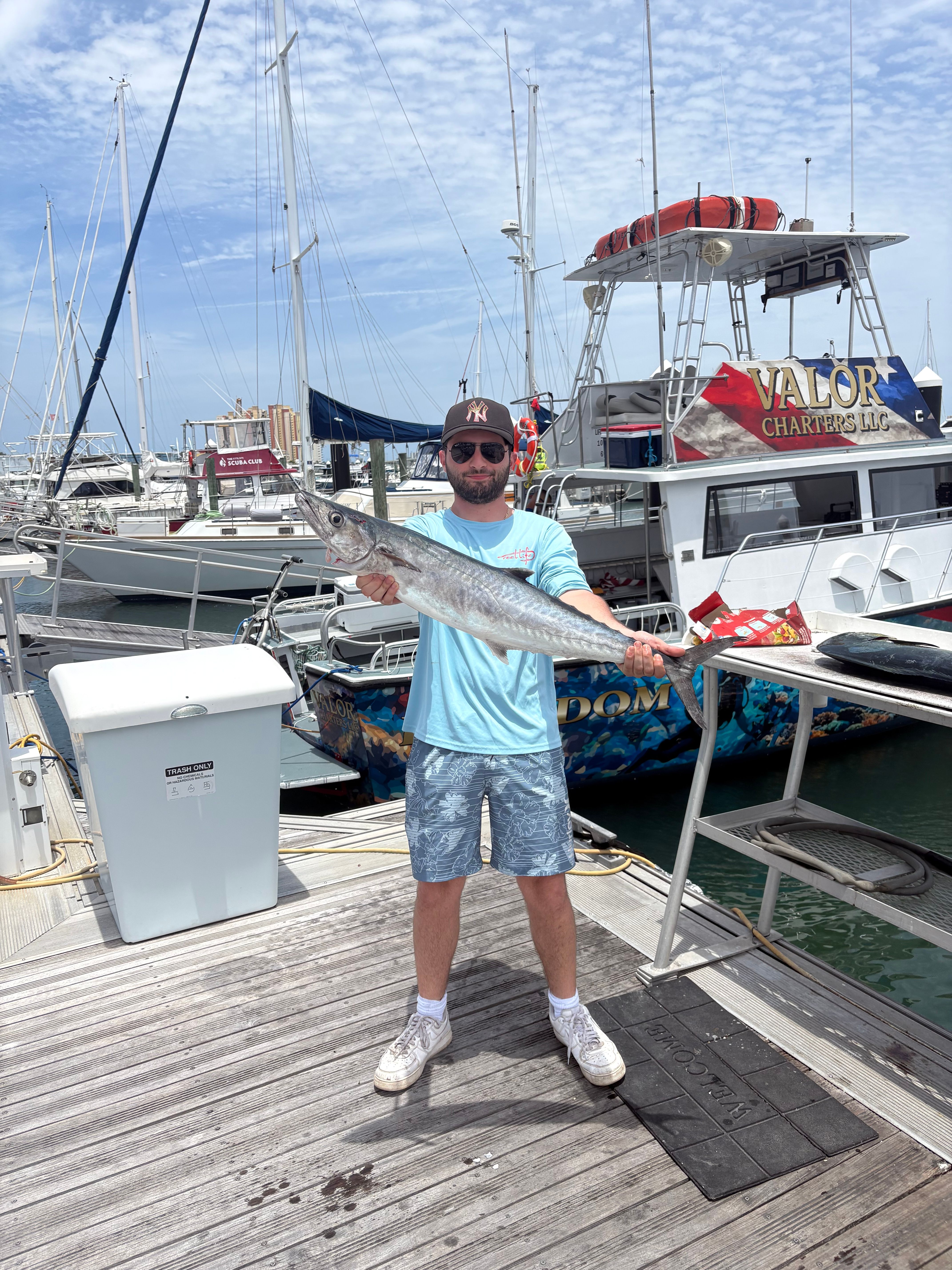 King mackerel catch displayed on fishing boat dock