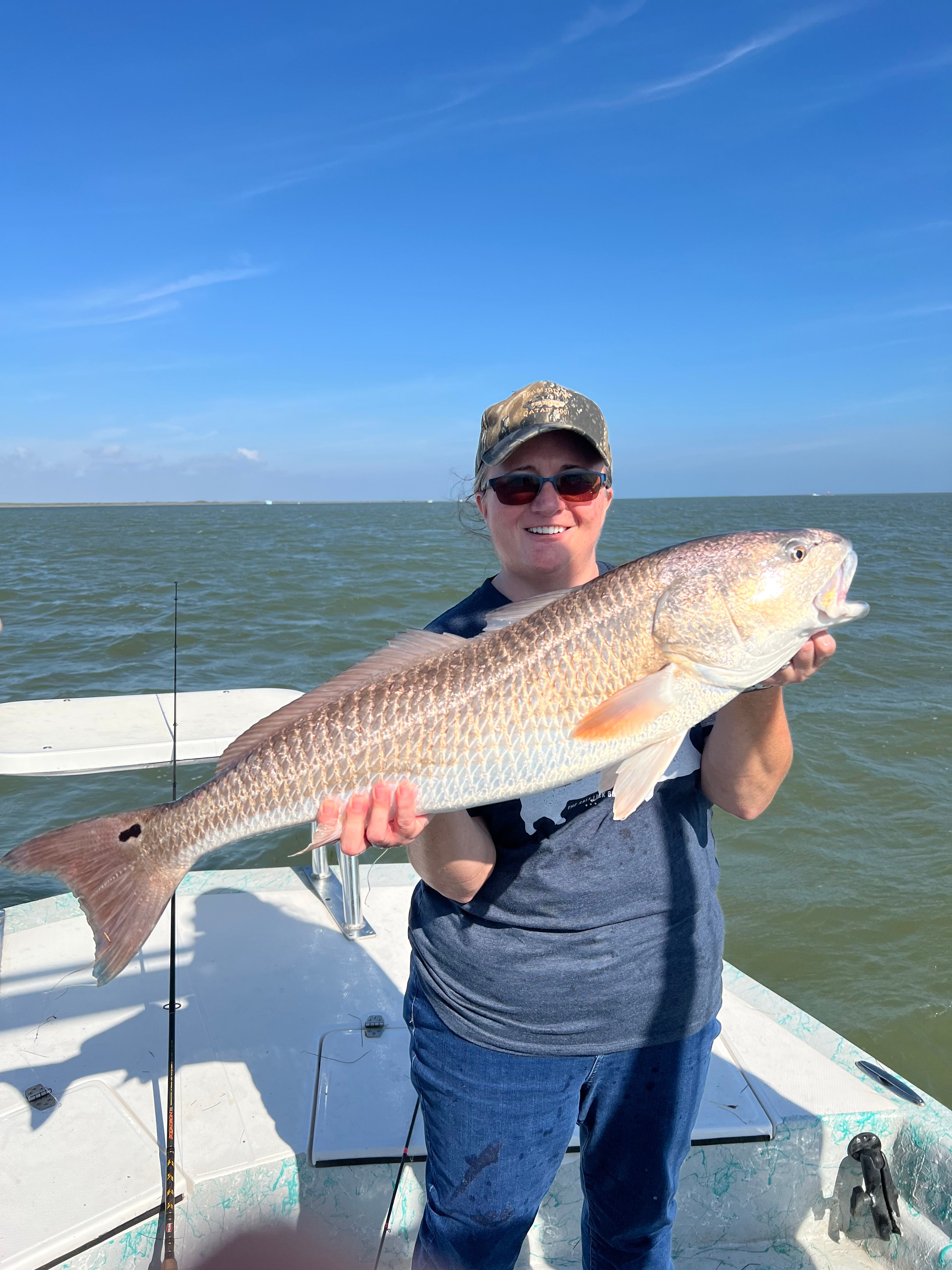 Catching a redfish while fishing