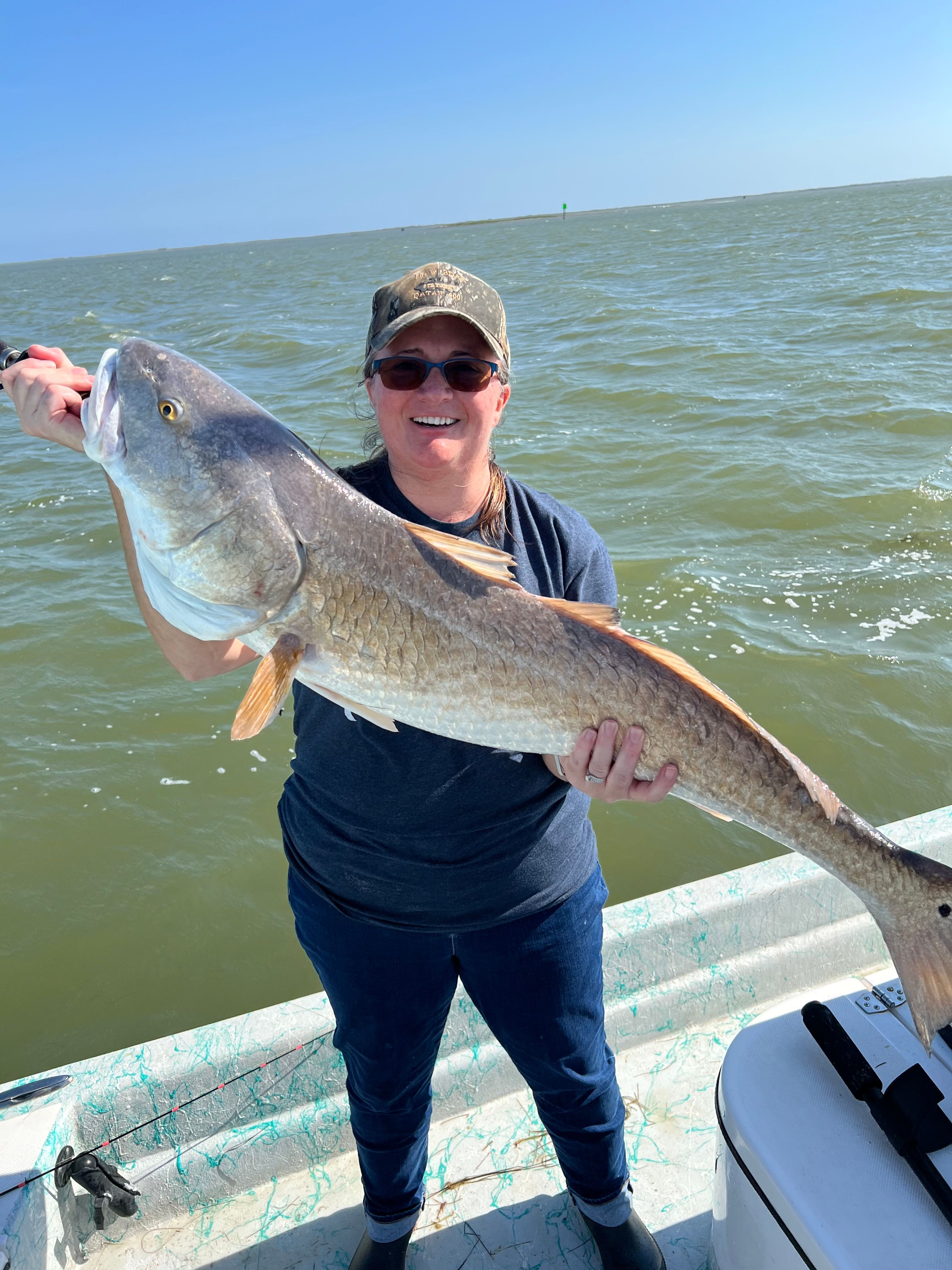 Fisherman with an unknown fish catch at an unknown location