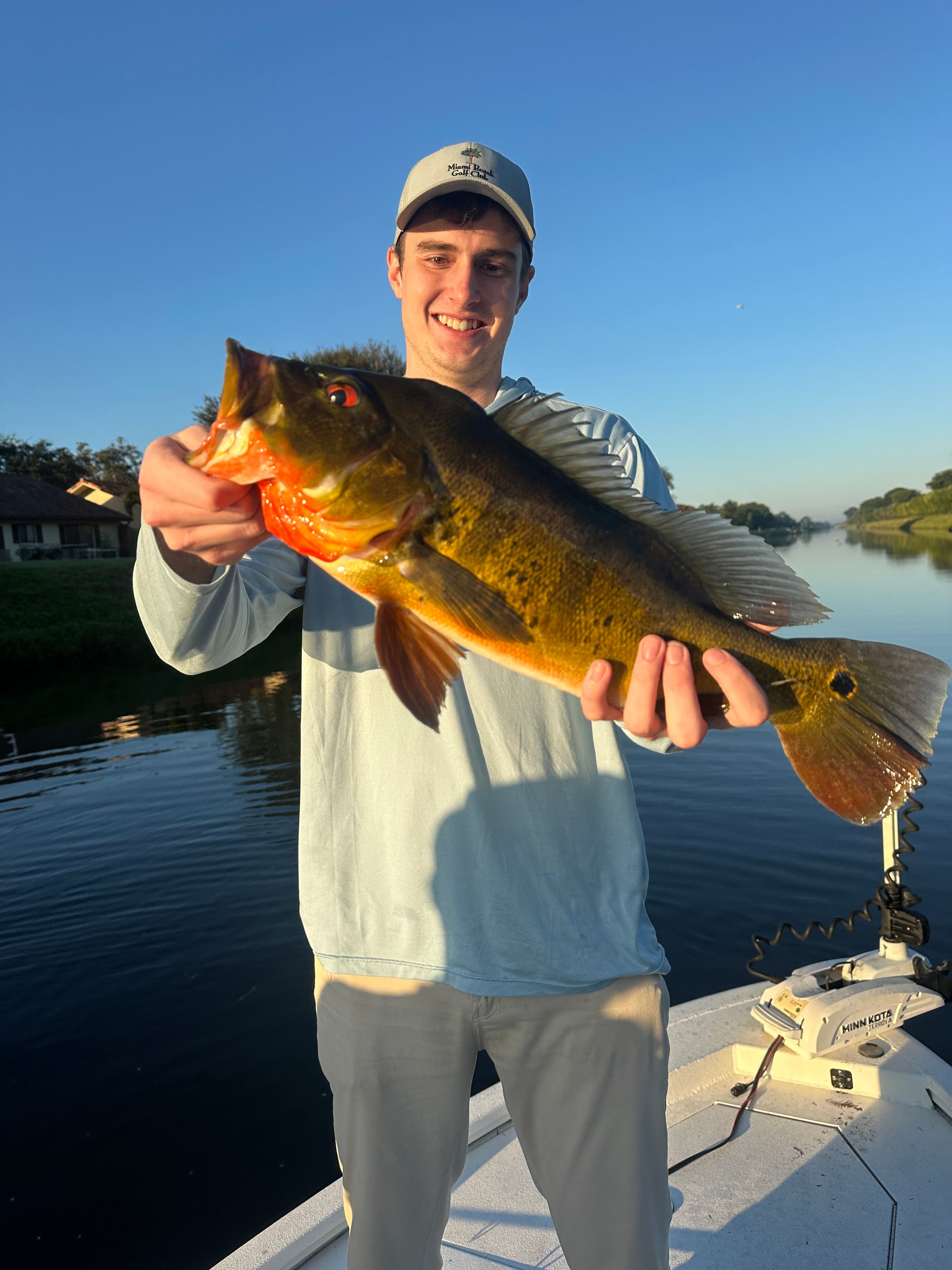 A person fishing in an unknown location