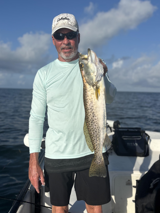 Reeling in the reds with perfect bait casting technique!