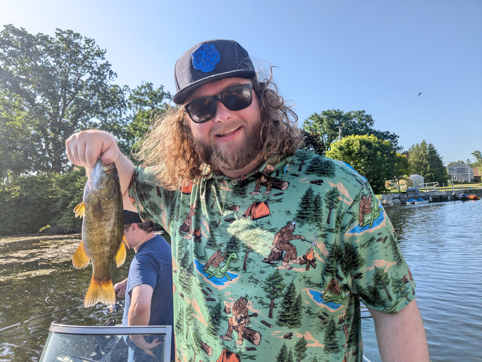 Hooked a prized smallmouth bass while trying a variety of fishing techniques in partly cloudy conditions!