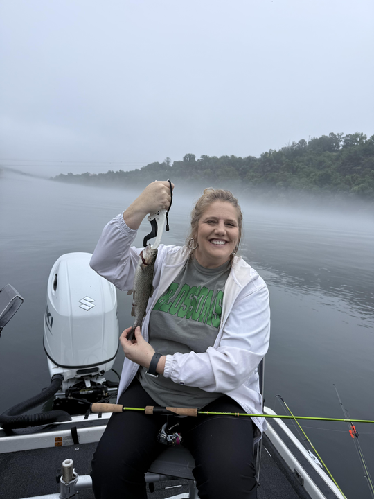 A feisty rainbow trout caught under partly cloudy skies - a perfect day for the best fishing!