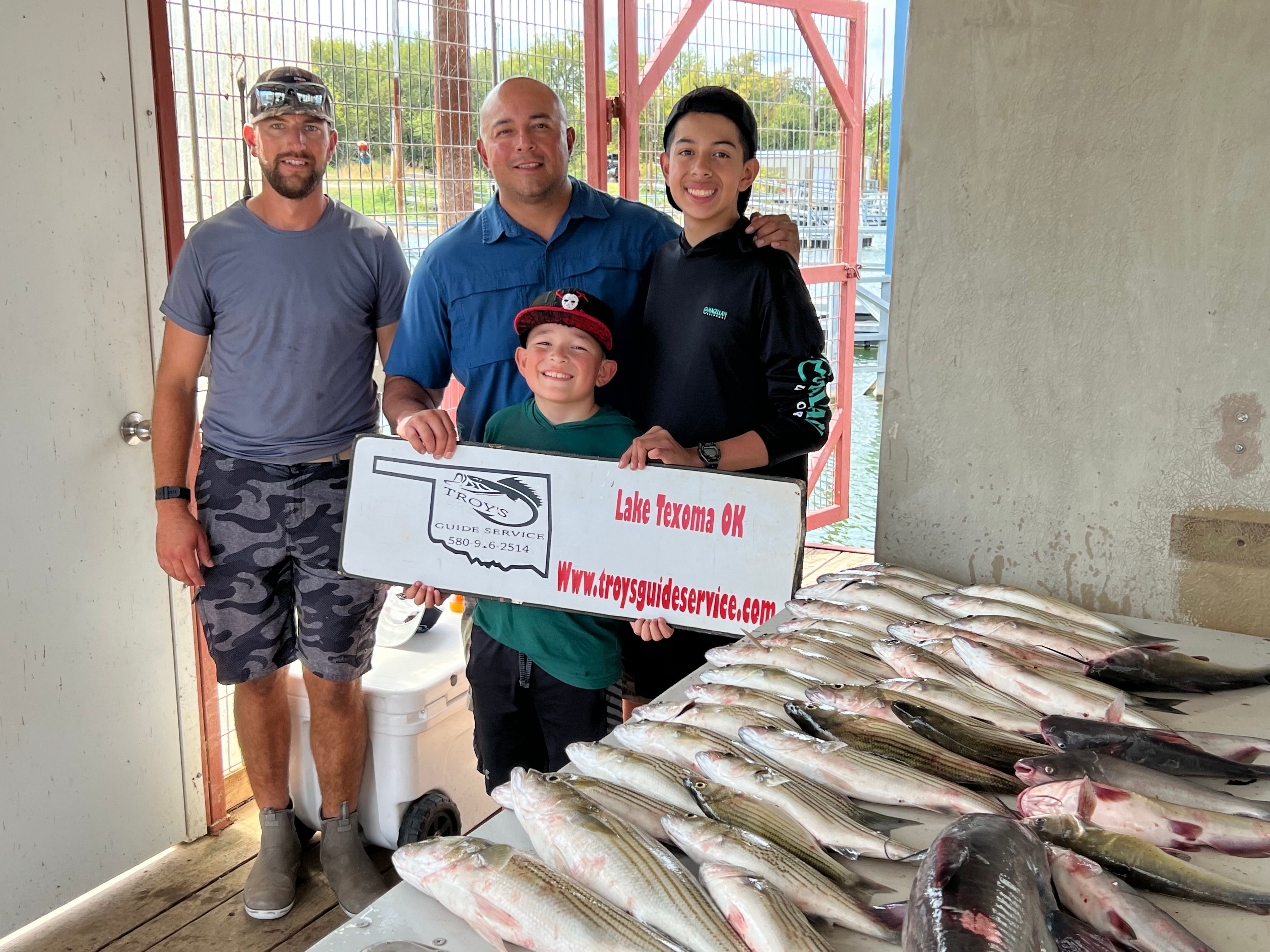 4 people fishing in an unknown location