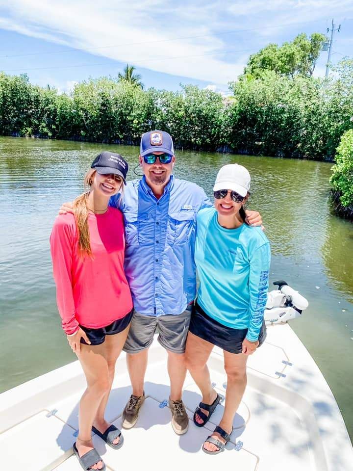 Three people enjoying a fishing excursion