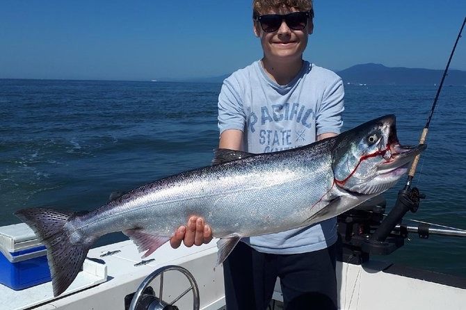 A Chinook Salmon, a 36-inch big fish, caught by a person while fishing.