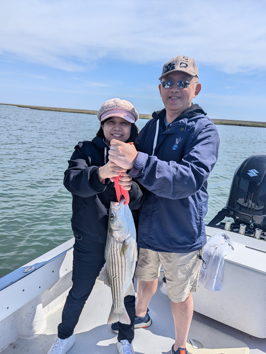 Hooked a big striped bass using various techniques on a partly cloudy day!