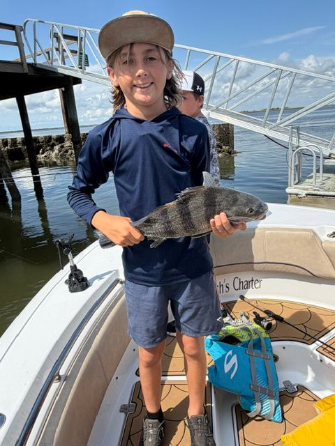 Black drum fish caught during fishing trip on boat