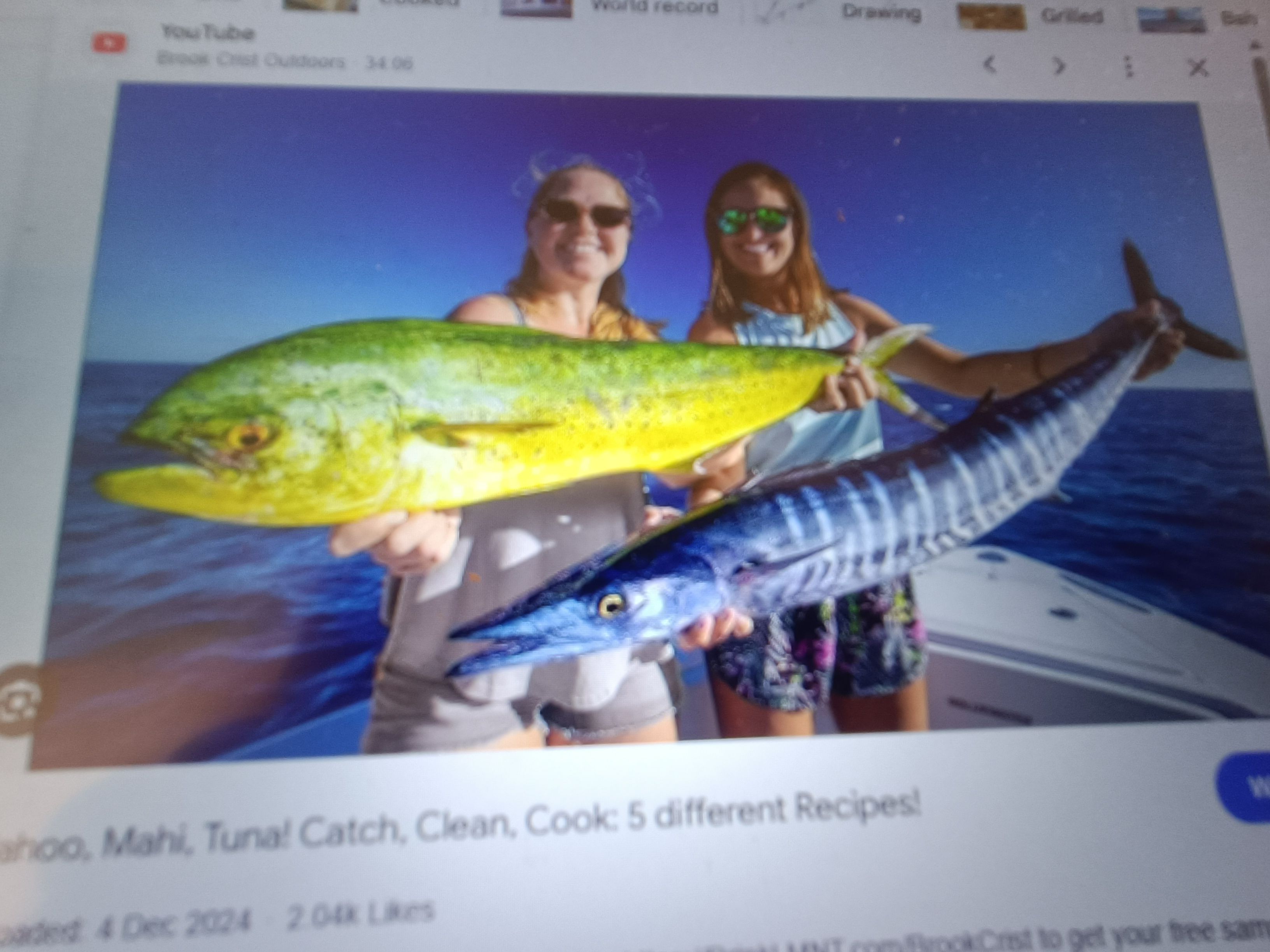 Two anglers fishing for wahoo fish