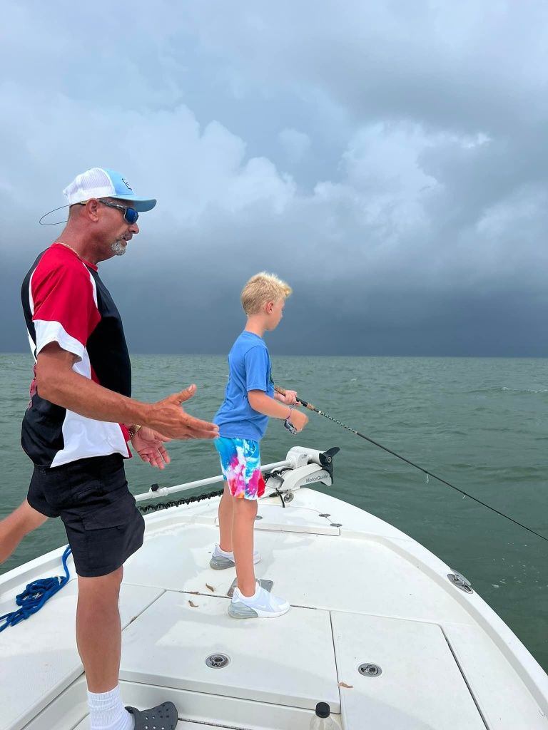 Two people fishing in an unknown location