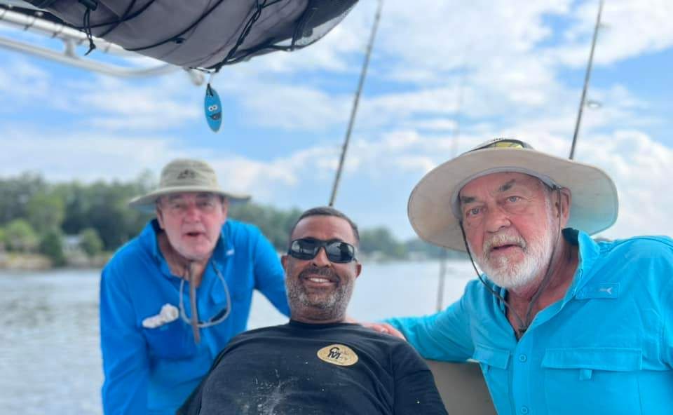 Three anglers fishing at an undisclosed location