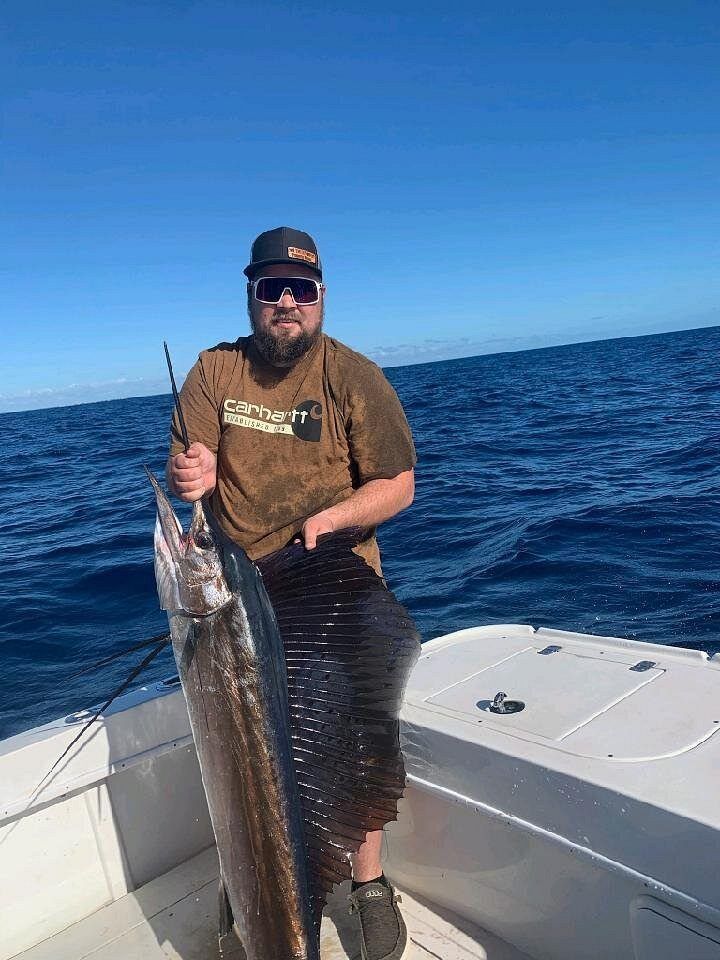 Angler catching a massive Atlantic Sailfish