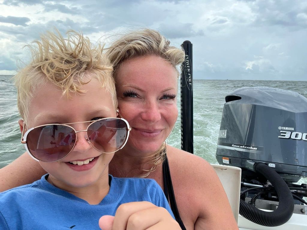 Two people fishing in an unknown location