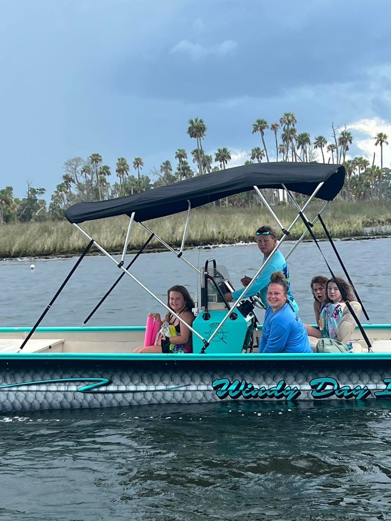 Group of 5 people fishing in a scenic location