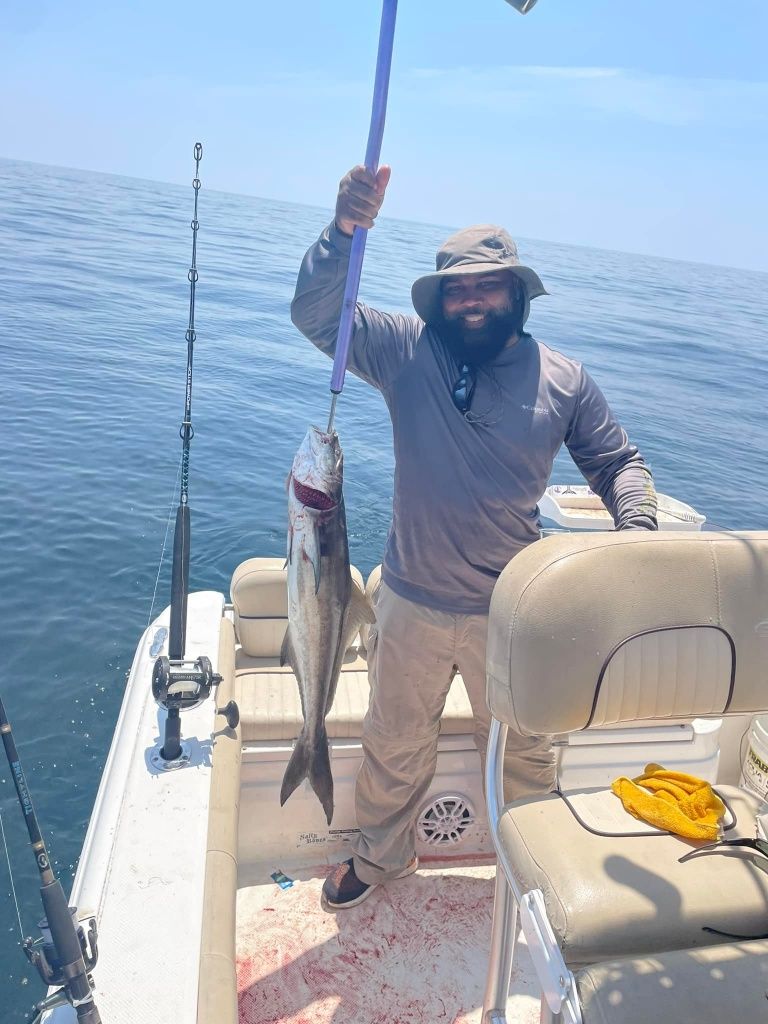 A bluefish measuring 24 inches caught while fishing