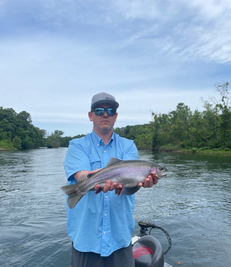 Anglers catch a rainbow trout