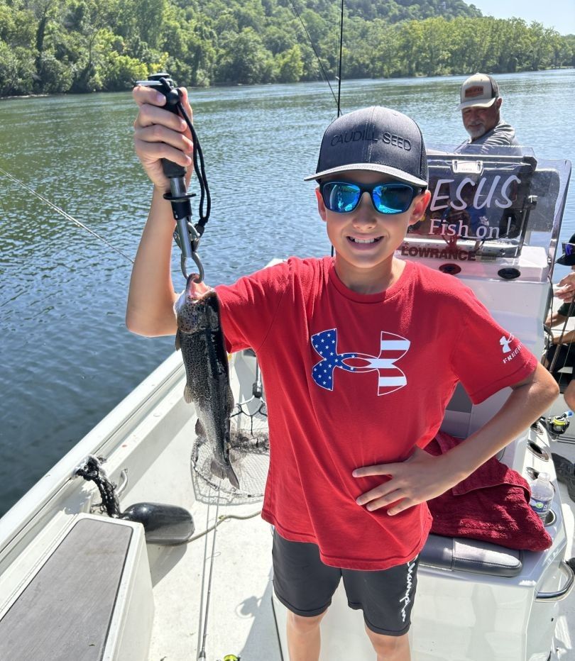 Smiling anglers with fishing gear in an unknown location