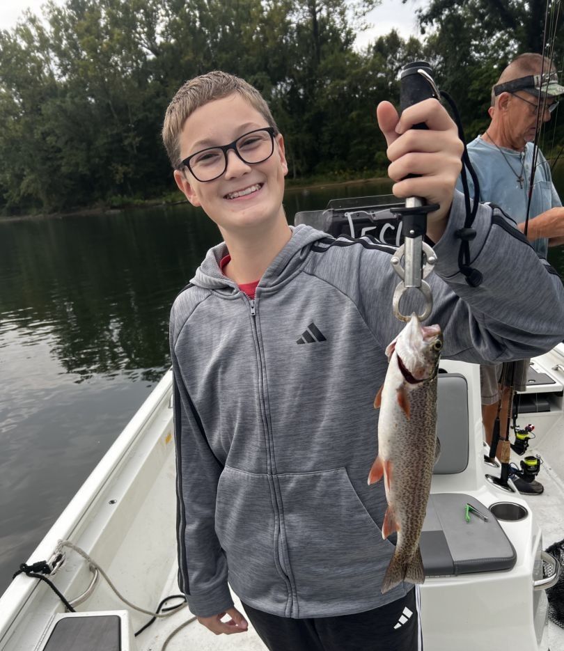 Two anglers fishing together in an unknown location