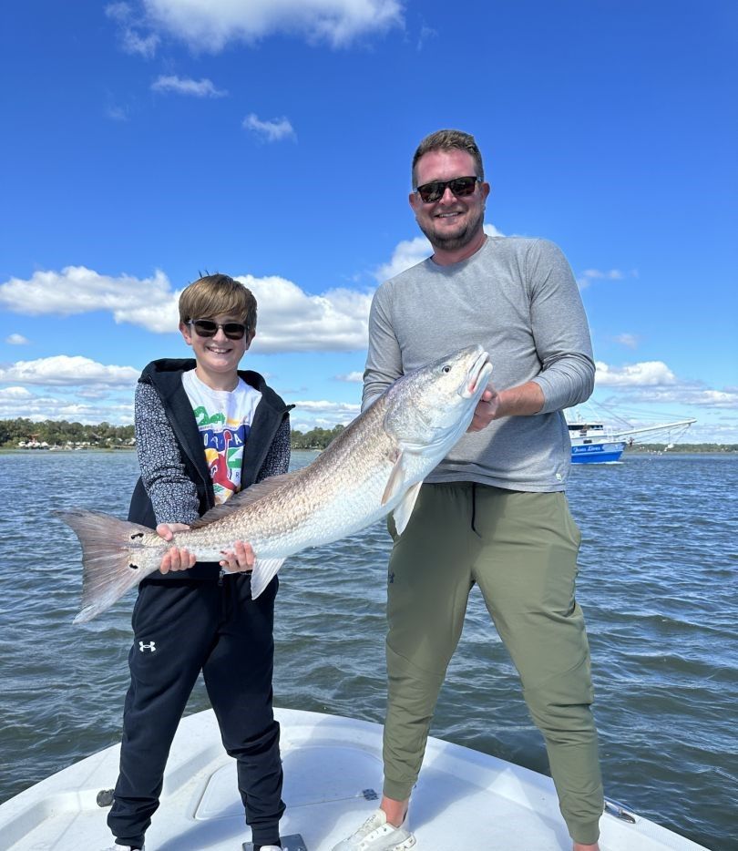 Two anglers fishing on a body of water