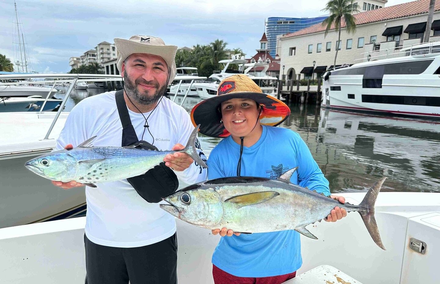 Two anglers fishing with best, great blackfin tuna and little tunny catch