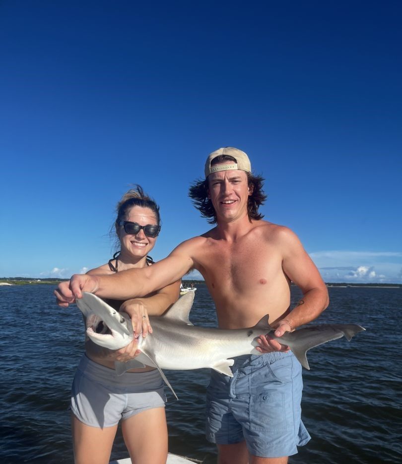 Anglers with a big fish caught while fishing