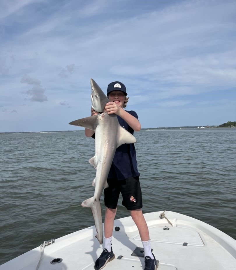 Photograph of a fisherman with a 39-inch Atlantic Sharpnose Shark catch