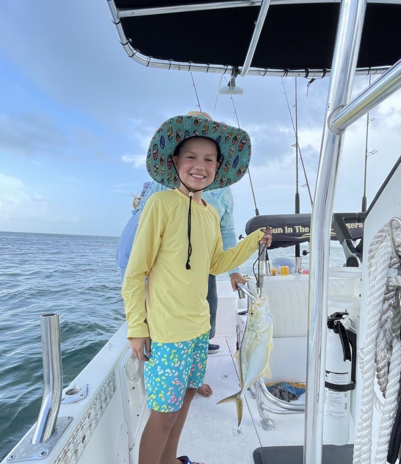 Bar jack caught while fishing on boat in open ocean waters